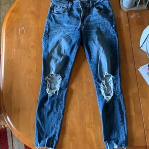 Rockstar style jeans with holes in the knees